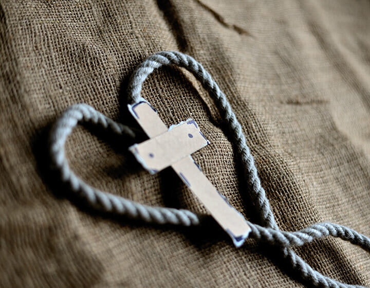 Rope necklace with a cross pendant